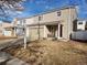 Charming two-story home with a two-car garage and neat landscaping, presenting an inviting facade at 4356 Andes Way, Denver, CO 80249