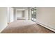 Bedroom features a balcony, closet, and carpet at 14152 E Linvale Pl # 408, Aurora, CO 80014