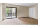 Large bedroom featuring carpet, a sliding glass door and a closet at 14152 E Linvale Pl # 408, Aurora, CO 80014