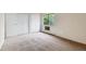 Bedroom featuring large closet and window with trees at 14152 E Linvale Pl # 408, Aurora, CO 80014