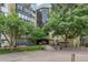 Apartment building surrounded by lush greenery, bench seating and offering a tranquil environment at 14152 E Linvale Pl # 408, Aurora, CO 80014