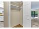 Bedroom closet with one shelf and wooden flooring at 14152 E Linvale Pl # 408, Aurora, CO 80014