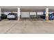Well-lit underground parking garage with designated parking spaces and concrete support columns at 14152 E Linvale Pl # 408, Aurora, CO 80014
