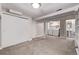 Basement with carpet, white trim, an open laundry area, and access to a bathroom at 4654 Bryant St, Denver, CO 80211