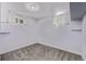 Finished basement with fresh paint, carpeting, and updated windows at 4654 Bryant St, Denver, CO 80211