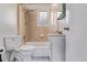 Bathroom featuring tile shower, blue tile floor and glass block window at 4654 Bryant St, Denver, CO 80211