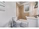 Bathroom featuring tile shower, blue tile floor and glass shelving at 4654 Bryant St, Denver, CO 80211