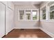 Bedroom with hardwood floors, closet, and windows for natural light at 4654 Bryant St, Denver, CO 80211