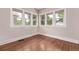 Bright bedroom with hardwood floors and large windows offering natural light at 4654 Bryant St, Denver, CO 80211
