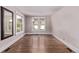 Bright, empty room with neutral walls, and hardwood floors. Perfect for customizing to your needs at 4654 Bryant St, Denver, CO 80211