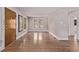 Bright, empty room with neutral walls, and hardwood floors. Perfect for customizing to your needs at 4654 Bryant St, Denver, CO 80211