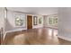 Bright, empty room with neutral walls, and hardwood floors. Perfect for customizing to your needs at 4654 Bryant St, Denver, CO 80211