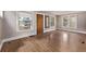 Bright, empty room with neutral walls, and hardwood floors. Perfect for customizing to your needs at 4654 Bryant St, Denver, CO 80211