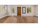 Bright, empty room with neutral walls, and hardwood floors. Perfect for customizing to your needs at 4654 Bryant St, Denver, CO 80211