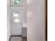 A small entry way with a blue tiled mat and a glass paned door at 4654 Bryant St, Denver, CO 80211