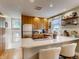 Bright kitchen featuring modern appliances, granite countertops, and a convenient breakfast bar at 4654 Bryant St, Denver, CO 80211