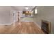 Open-concept living room with hardwood floors leading to a bright and modern kitchen at 4654 Bryant St, Denver, CO 80211