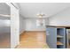 This open living room features hardwood floors, a ceiling fan, natural light and neutral paint colors at 1811 S Norfolk St, Aurora, CO 80017