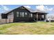 A well-maintained yard with a wooden fence and inviting backyard patio and outdoor furniture at 740 W County Road 10E, Berthoud, CO 80513