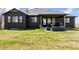 Expansive backyard featuring a covered patio with stylish outdoor furniture at 740 W County Road 10E, Berthoud, CO 80513