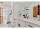 Bathroom featuring dual sink vanity and frameless glass shower at 740 W County Road 10E, Berthoud, CO 80513