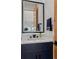 Bathroom with modern vanity, stylish mirror, and accent lighting at 740 W County Road 10E, Berthoud, CO 80513