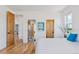 Bedroom featuring hardwood floors and bright light at 740 W County Road 10E, Berthoud, CO 80513