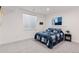 Bright bedroom featuring a blue quilt, and minimalist design at 740 W County Road 10E, Berthoud, CO 80513