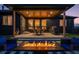 Inviting covered patio with a fire pit and outdoor dining area perfect for entertaining at 740 W County Road 10E, Berthoud, CO 80513