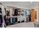 Spacious walk-in closet with custom shelving and plenty of storage for clothes and shoes at 740 W County Road 10E, Berthoud, CO 80513