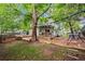 A spacious backyard featuring a charming deck and play area, perfect for Gathering fun and outdoor enjoyment at 1409 Quince Ave, Boulder, CO 80304