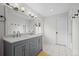 Bathroom featuring double sinks, gray vanity, and modern fixtures at 1409 Quince Ave, Boulder, CO 80304