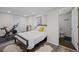 Bedroom with a large bed, workout equipment, and a view of the bathroom at 1409 Quince Ave, Boulder, CO 80304
