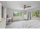 Bedroom with a ceiling fan, natural light from windows and views of trees at 1409 Quince Ave, Boulder, CO 80304