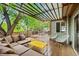 Outdoor deck with a large sectional, a yellow table, and a dining set at 1409 Quince Ave, Boulder, CO 80304