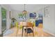 Dining area next to a gourmet kitchen with stylish finishes and lots of natural light at 1409 Quince Ave, Boulder, CO 80304