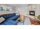 Warm living room featuring hardwood floors, a fireplace, and neutral decor at 1409 Quince Ave, Boulder, CO 80304