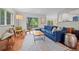 Open concept living room flows to a dining area with access to the patio at 1409 Quince Ave, Boulder, CO 80304