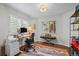 Office space with desk, ergonomic chair, keyboard, and colorful rug at 1409 Quince Ave, Boulder, CO 80304