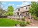 Beautiful backyard with a deck, lawn, and lovely landscaping at 18027 E Ida Dr, Centennial, CO 80015
