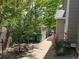 Manicured backyard with roses, a storage shed, landscaping, and a pathway at 18027 E Ida Dr, Centennial, CO 80015