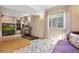 Finished basement with a treadmill, entertainment center and large window allowing natural light at 18027 E Ida Dr, Centennial, CO 80015
