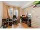 Bedroom with hardwood floors, neutral walls, and a window providing natural light at 18027 E Ida Dr, Centennial, CO 80015