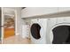 Laundry room with washer, dryer, freezer and storage cabinets at 18027 E Ida Dr, Centennial, CO 80015