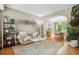 Comfortable living room with hardwood floors, a view into the dining area, and neutral decor at 18027 E Ida Dr, Centennial, CO 80015