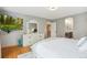 Comfortable main bedroom with ensuite bathroom and large, decorative dresser at 18027 E Ida Dr, Centennial, CO 80015