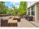 Cozy outdoor patio with a fire pit, comfortable seating, and a grill at 18027 E Ida Dr, Centennial, CO 80015