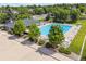 Aerial view of a community pool with lounge chairs and mature landscaping at 18027 E Ida Dr, Centennial, CO 80015