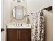 Chic powder room features a modern vanity, decorative mirror, and stylish towel rack at 18027 E Ida Dr, Centennial, CO 80015