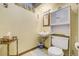 Bathroom featuring vanity sink, toilet, and cabinet storage, creating a functional space at 7651 Shoshone St, Denver, CO 80221